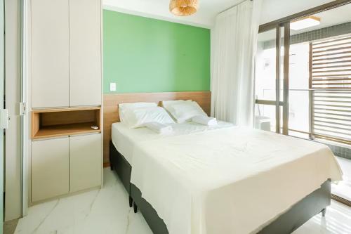 Cama ou camas em um quarto em Apartamento na Barra