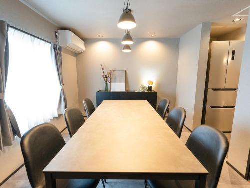 a conference room with a table and chairs at IZUMO DOGS by HIYORISTAY in Izumo