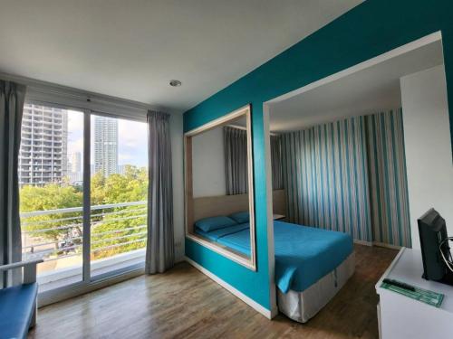 Ένα ή περισσότερα κρεβάτια σε δωμάτιο στο D@Sea Hotel