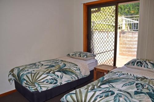 Ένα ή περισσότερα κρεβάτια σε δωμάτιο στο Seaview Townhouse 3 - Bring your own linen.