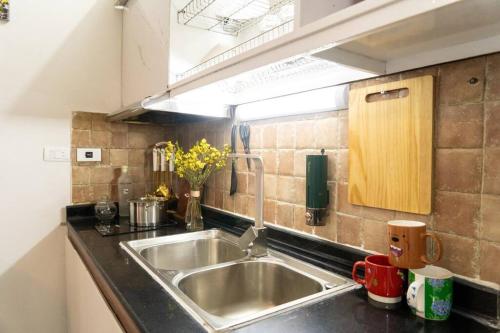 Nhà bếp/bếp nhỏ tại Hione Stay