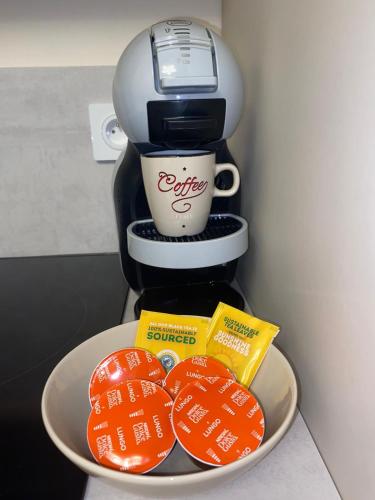 a plate with a coffee maker and a cup of coffee at ON VACAY - Votre havre de paix à 100 m des plages in Cannes