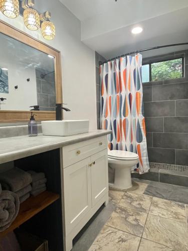 a bathroom with a sink and a toilet at Holualoa Gardens 104 in Kailua-Kona