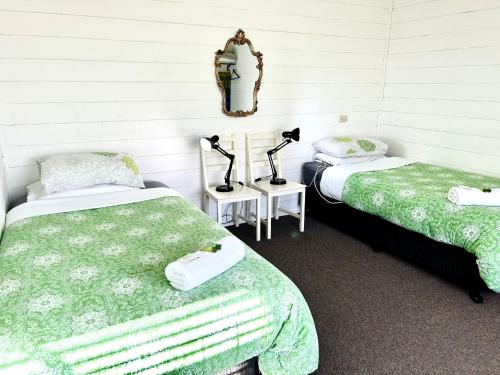 Ένα ή περισσότερα κρεβάτια σε δωμάτιο στο Breakaway Cottage