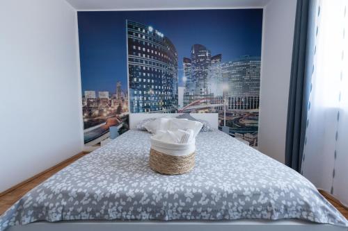 a bedroom with a poster of a city skyline at APARTMAN MAKSAN in Pakoštane