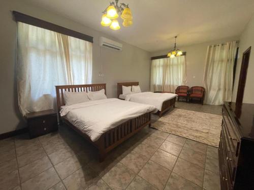 Ένα ή περισσότερα κρεβάτια σε δωμάτιο στο Olivia Guesthouse