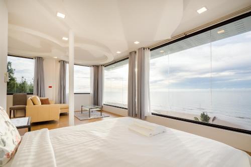 Ένα ή περισσότερα κρεβάτια σε δωμάτιο στο TERMSUK EXCLUSIVE BEACHFRONT VILLAS CHA-AM