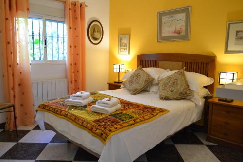 Postel nebo postele na pokoji v ubytování Villa Val de Rosa