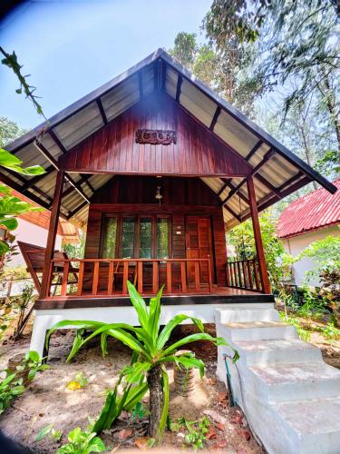 a house in the middle of a forest at Ziggy Stardust in Ko Phayam