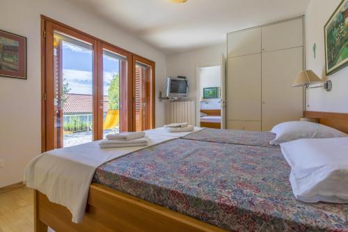 Postel nebo postele na pokoji v ubytování HAUS KATARINA
