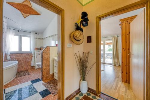 a bathroom with a tub and a toilet and a sink at Ivana in Karpijan in Umag