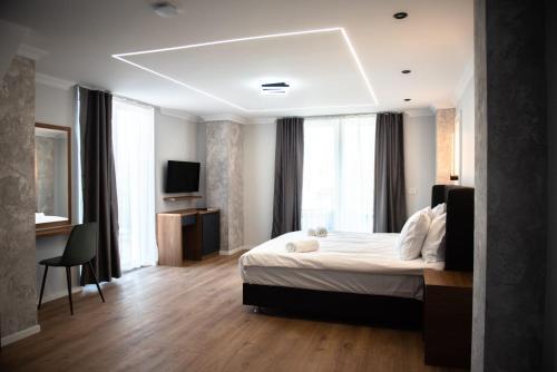 Postel nebo postele na pokoji v ubytování Hotel Luciano
