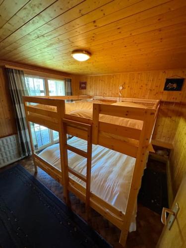 an overhead view of a bedroom with two bunk beds at Chalet Glücksfall in Bellwald