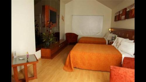Ein Bett oder Betten in einem Zimmer der Unterkunft Autohotel VERSALLES