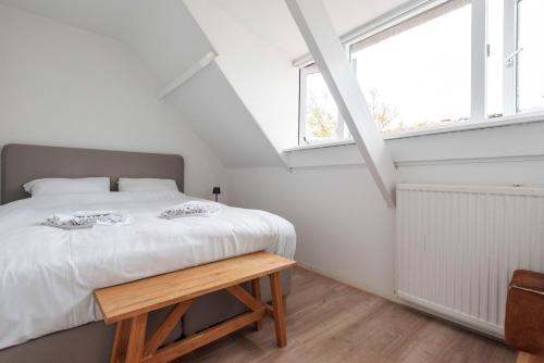 Una cama o camas en una habitación de Zilt & Zand