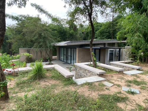 a house in the middle of a forest at Walden in Nohan