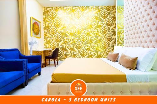 a bedroom with a bed and a yellow and white wall at PICO DE LORO Pool Accessible CAROLA 3 Bedroom Units by SEE Condominiums in Cutad