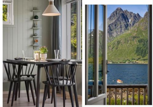 a dining room table with a view of the water and mountains at Sildpollnes Lodge in Vestpollen