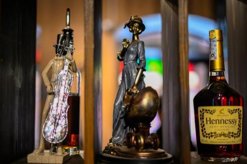 a figurine of a man standing next to a bottle of wine at Dzvel Ubanshi in Gori