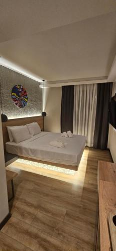 a bedroom with a large bed in a room at Glitz Bodrum in Bodrum City