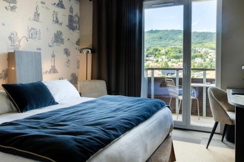 Postel nebo postele na pokoji v ubytování Best Western Plus Hôtel Gergovie