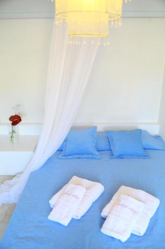 Ένα ή περισσότερα κρεβάτια σε δωμάτιο στο Nama Villas 