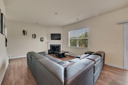a living room with a couch and a fireplace at Beautifull house near Airport in Charlotte