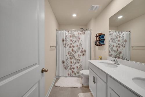 a bathroom with a shower and a toilet and a sink at Beautifull house near Airport in Charlotte