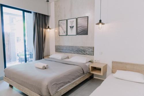 Katil atau katil-katil dalam bilik di Gemini Star Hotel Kuta