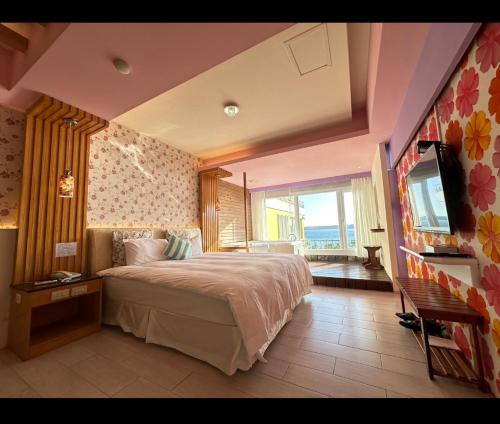 Postel nebo postele na pokoji v ubytování 南灣飯店 Kenting Nanwan Hotel