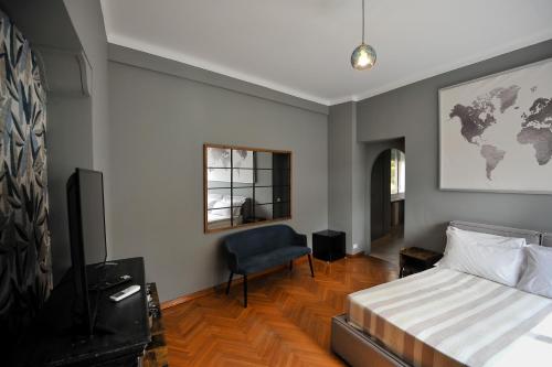 Postel nebo postele na pokoji v ubytování Boutique Suites Valadier