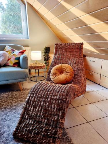 a couch with a pumpkin on it in a living room at Ferienwohnung Freudentanz in Waldmünchen
