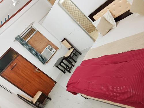 Un ou plusieurs lits dans un hébergement de l'établissement Krishna cottage