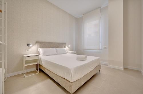 Ένα ή περισσότερα κρεβάτια σε δωμάτιο στο Apartamentos Panda By Clabao
