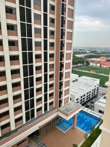 a view from the balcony of a building with a swimming pool at Homestay Rumah Kita Edusentral Setia Alam in Setia Alam