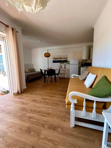 a bedroom with a bed and a kitchen and a table at Lagoa Beach & Leisure in Costa de Santo André