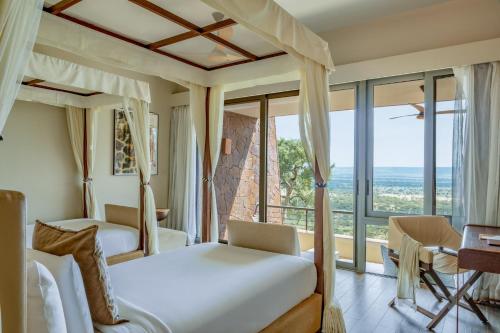 Letto o letti in una camera di Meliá Serengeti Lodge Member of Meliá Collection
