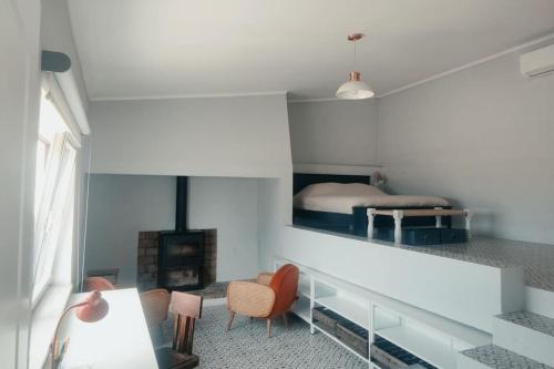 una camera con letto e camino di House near Elvas on Olive Farm a Monte do Falcato