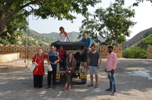 a group of people standing in front of a truck at Chillout - A Boutique Hotel & Rooftop Restaurant Jaipur in Jaipur