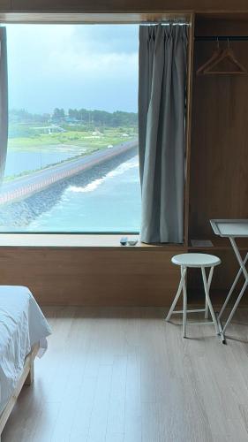 Postel nebo postele na pokoji v ubytování Beau Blue Pension