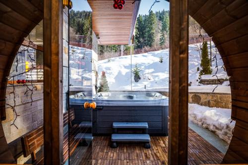 a bathroom with a sink and a snow covered slope at Musala Hotel in Borovets