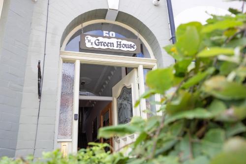 a sign that reads no it green bugs over a door at The Green House Guest House in Liverpool