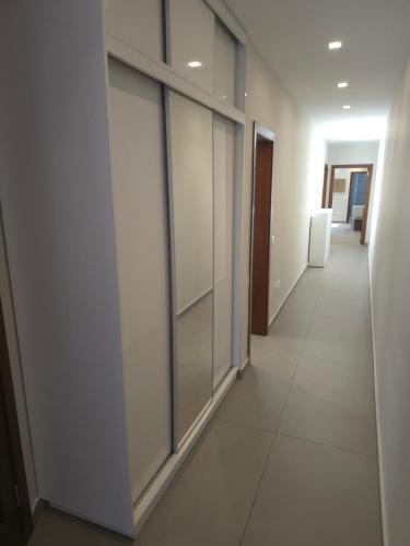 a corridor of an office with sliding glass doors at The Msida View apartment in Msida