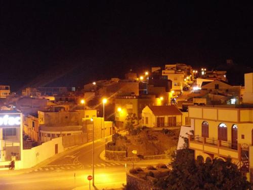 a city at night with street lights and buildings at Casa Comba in Mindelo