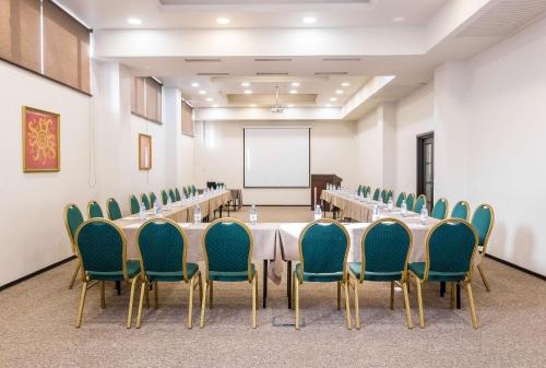 a conference room with a long table and chairs at Best Western Plus Atakent Park Hotel in Almaty