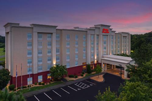 a rendering of a hotel at dusk at Hampton Inn & Suites Durham North I-85 in Durham