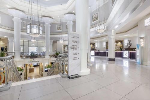 a large lobby with white columns and a building at Hilton Grand Vacations Club on the Las Vegas Strip in Las Vegas