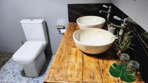 a bathroom with a sink and a toilet at Amanya Hut 3-Bedroom House Amboseli in Amboseli
