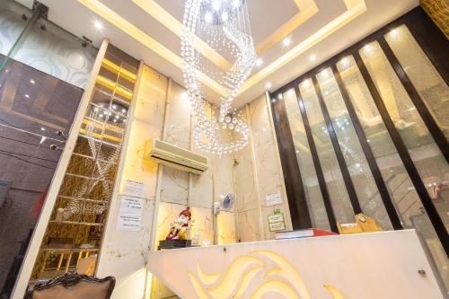a store front with a chandelier on the wall at Hotel Gold Souk - Karol Bagh in New Delhi