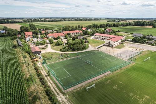 an aerial view of an estate with a tennis court at Hotel Heaven in Chabsko